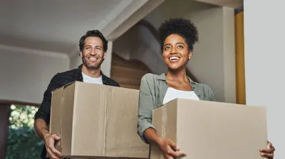 Happy young couple holding house keys
